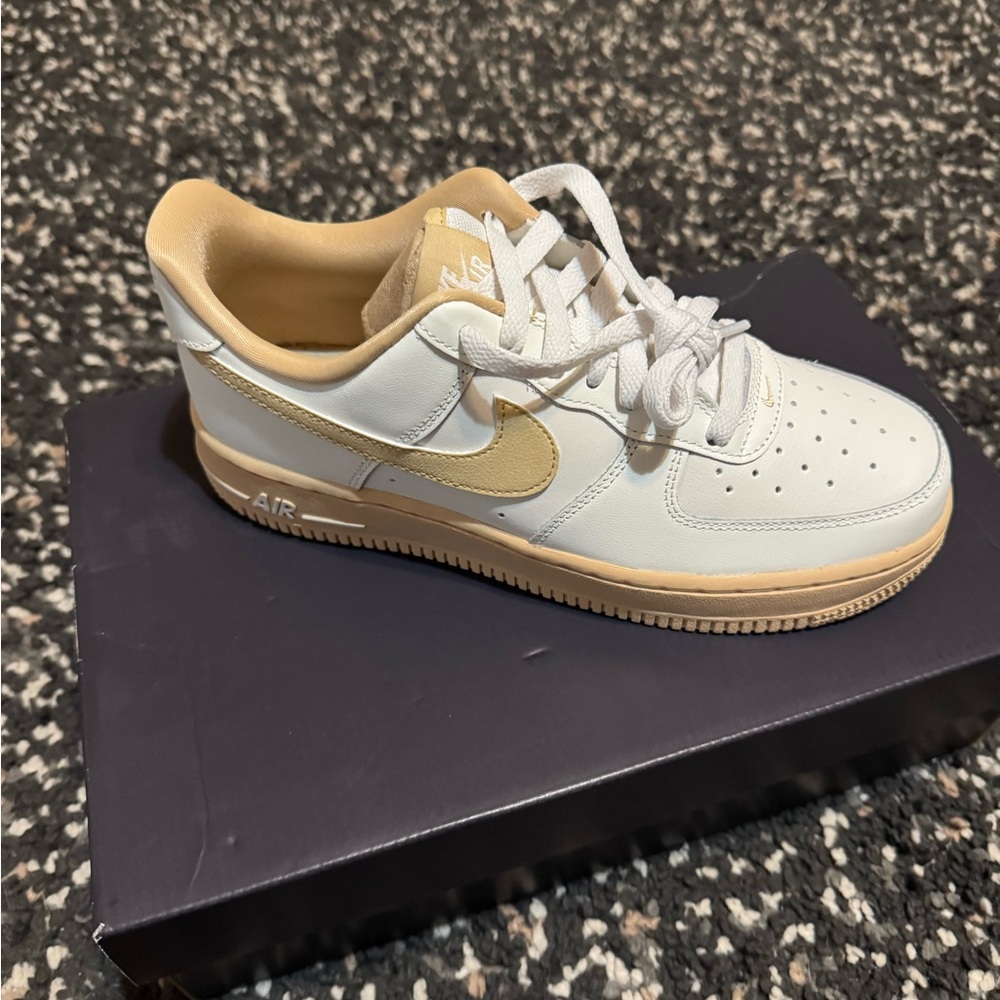 Nike Air Force 1 White and Gold Sneakers